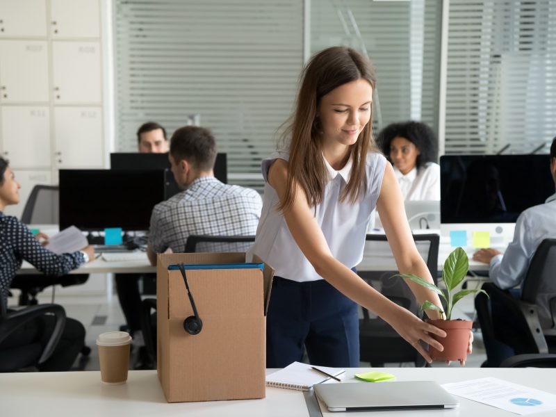 Smiling,Hired,Female,Company,Employee,Unpacking,Box,With,Personal,Belongings