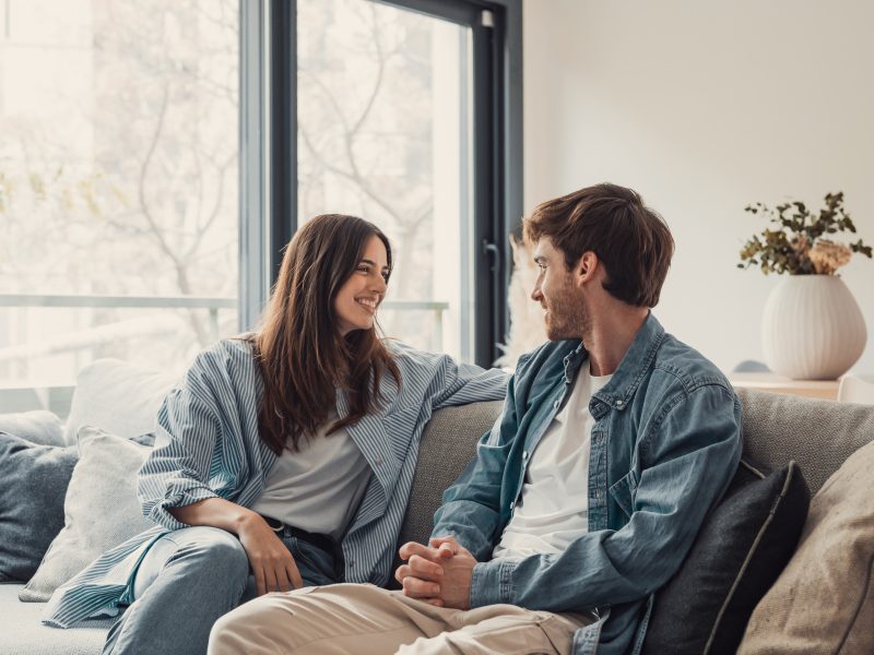 Young,Happy,Couple,Having,Fun,Talking,Laughing,Relaxing,At,Home